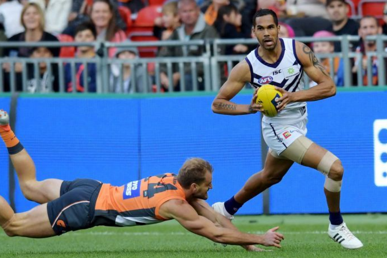 Fleet-footed Shane Yarran gets the better of an opponent during one of his six games for Fremantle.
