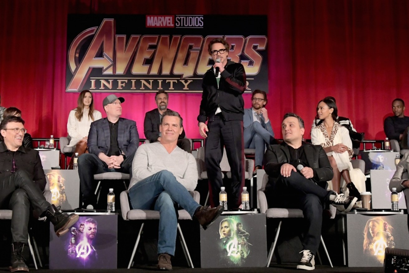 Robert Downey Jr (standing) has his moment in the sun during the star-studded <i>Avengers: Infinity War</i> press conference.