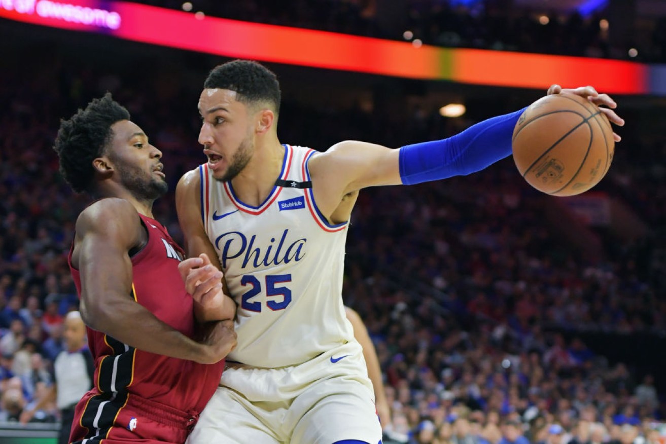 Ben Simmons fights off Justise Winslow as the 76ers beat the Miami Heat in the playoffs.