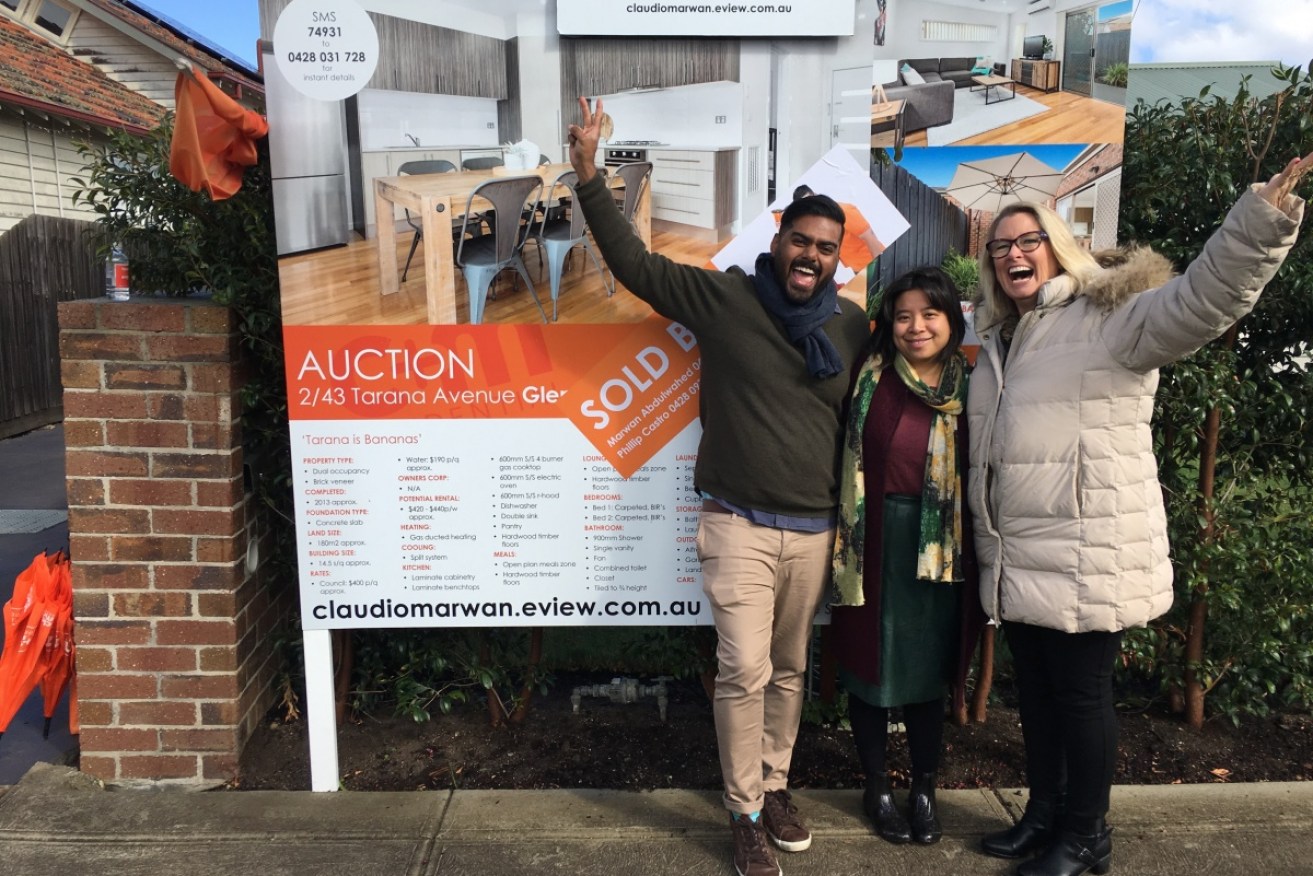 Buyers Home Base Director Julie DeBondt-Barker with some happy first home buyers. Photo: Supplied