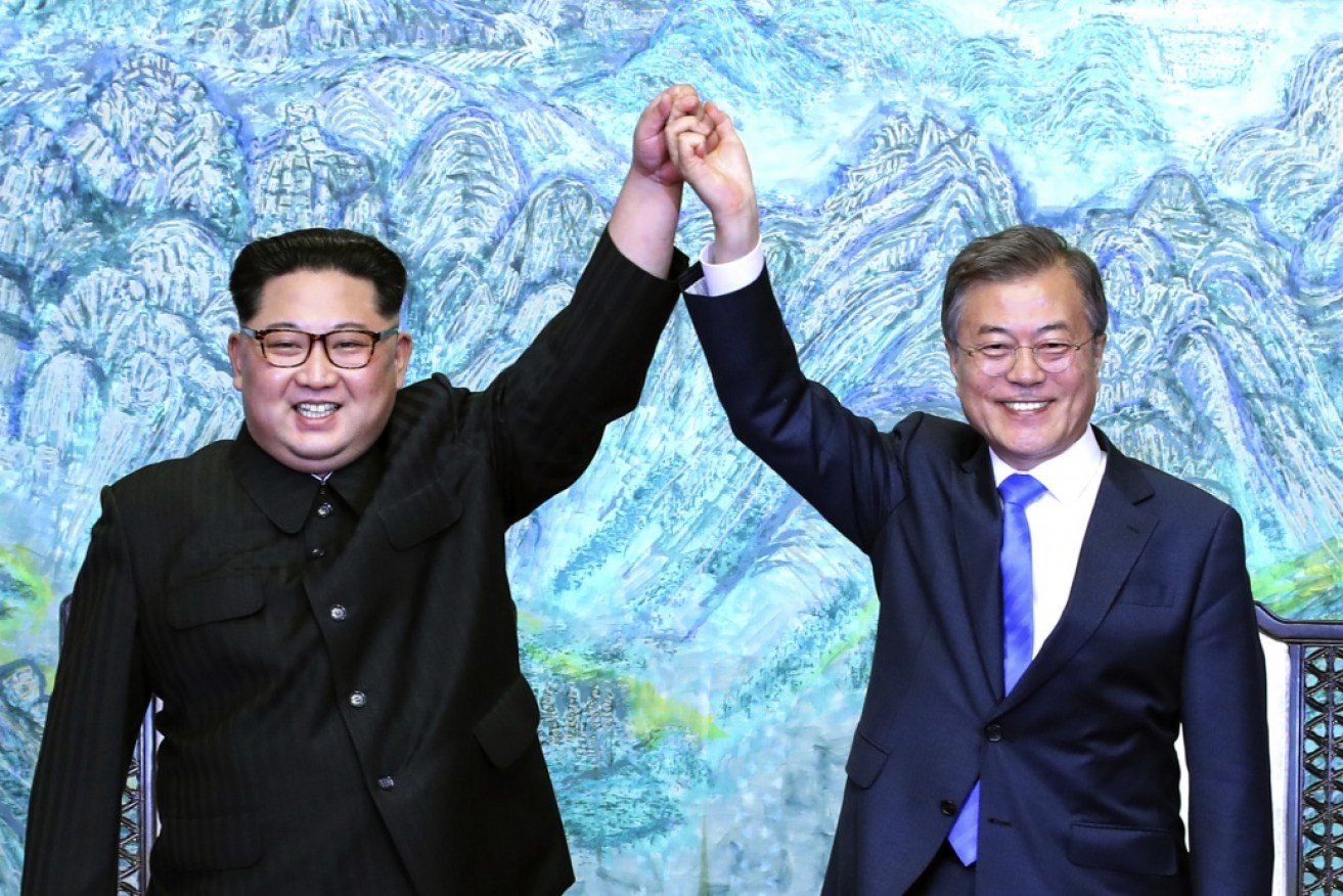 North Korea's Kim Jong-un and South Korean President Moon Jae-in shake hands to cement their pact to end the state of war.