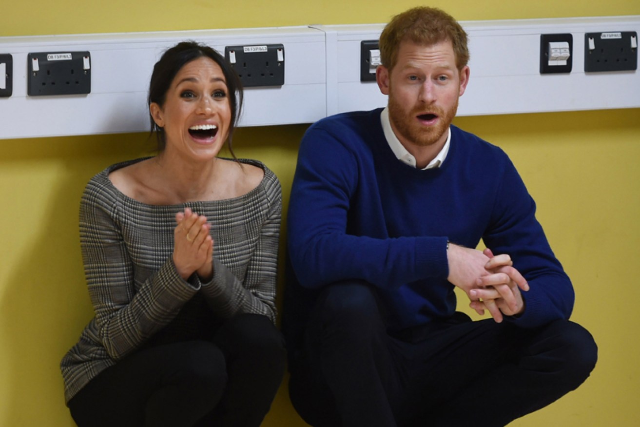 Meghan and Harry drop effortlessly into a crouch at a street dance class in Cardiff in January.