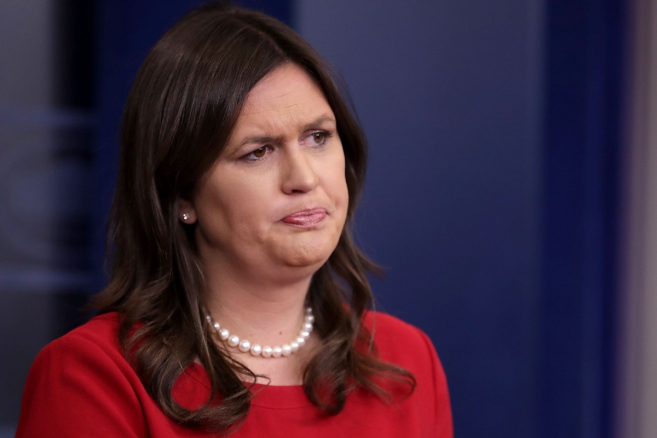 Sarah Huckabee Sanders says she didn't know about the Stormy Daniels payment.