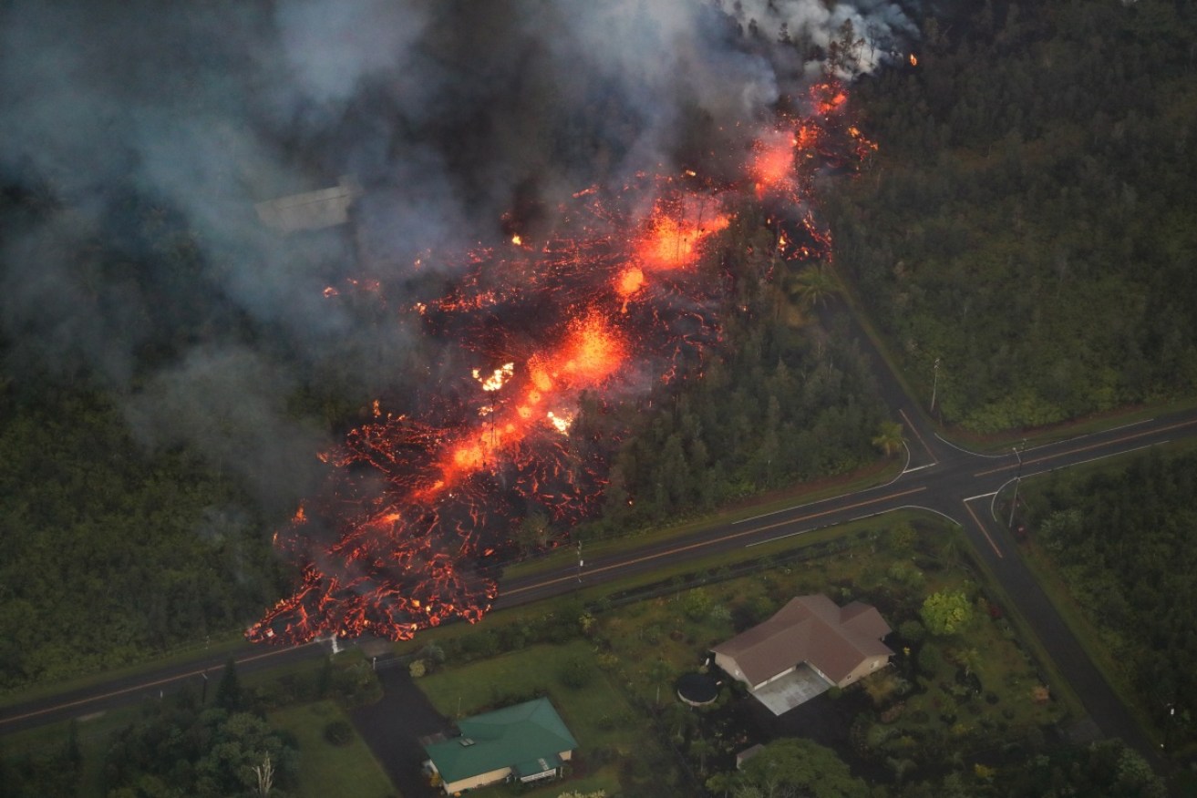 A 2000 foot long fissure erupts within the Leilani Estates subdivision, on the east rift zone of the Kilauea volcano.  