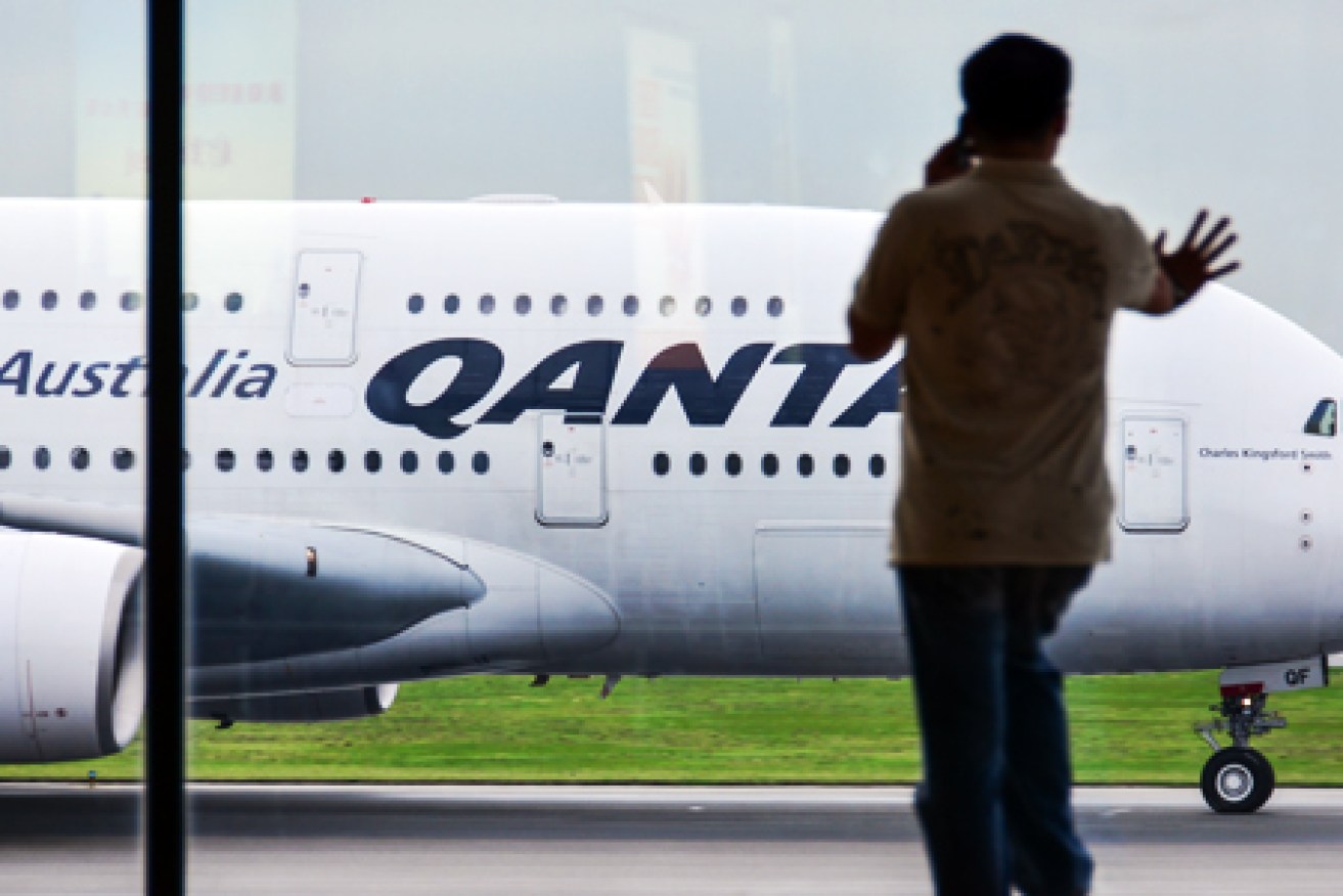Qantas says it will accede to China's demands after missing the deadline to change its site.