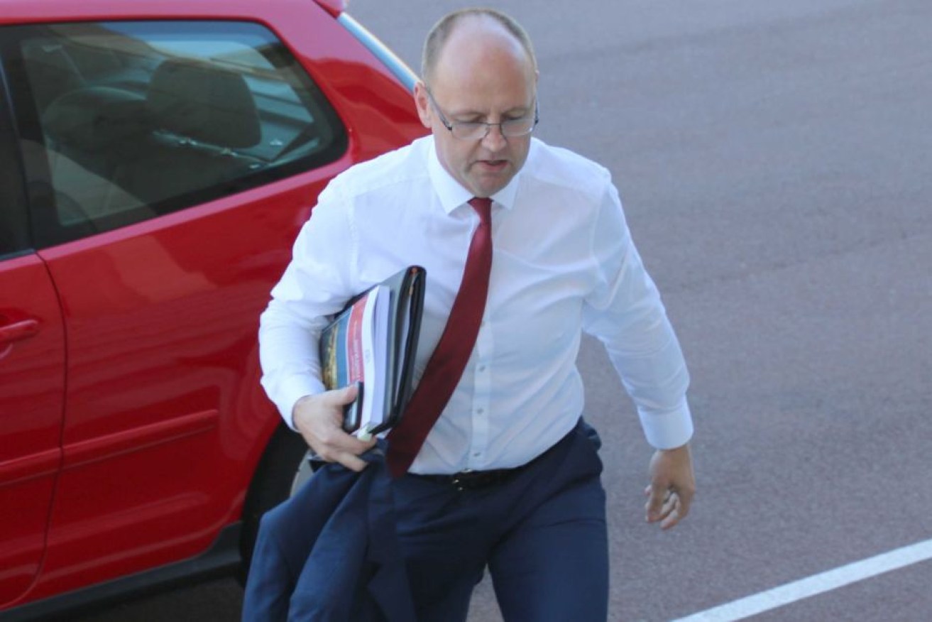 Embattled MP Barry Urban arrived at Parliament ahead of the report being handed down.