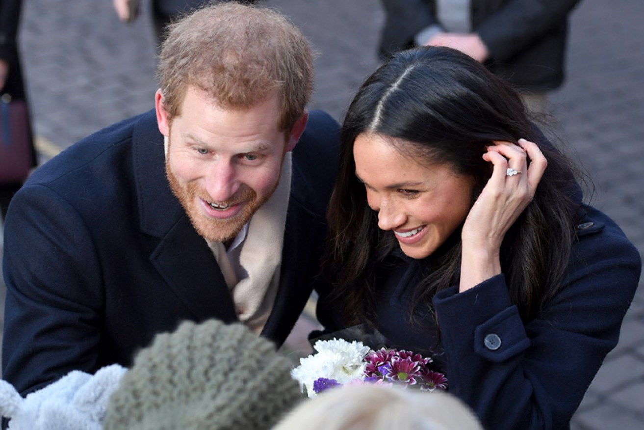 Four days after their engagement news, Prince Harry and Meghan Markle cooed over a baby in Nottingham.