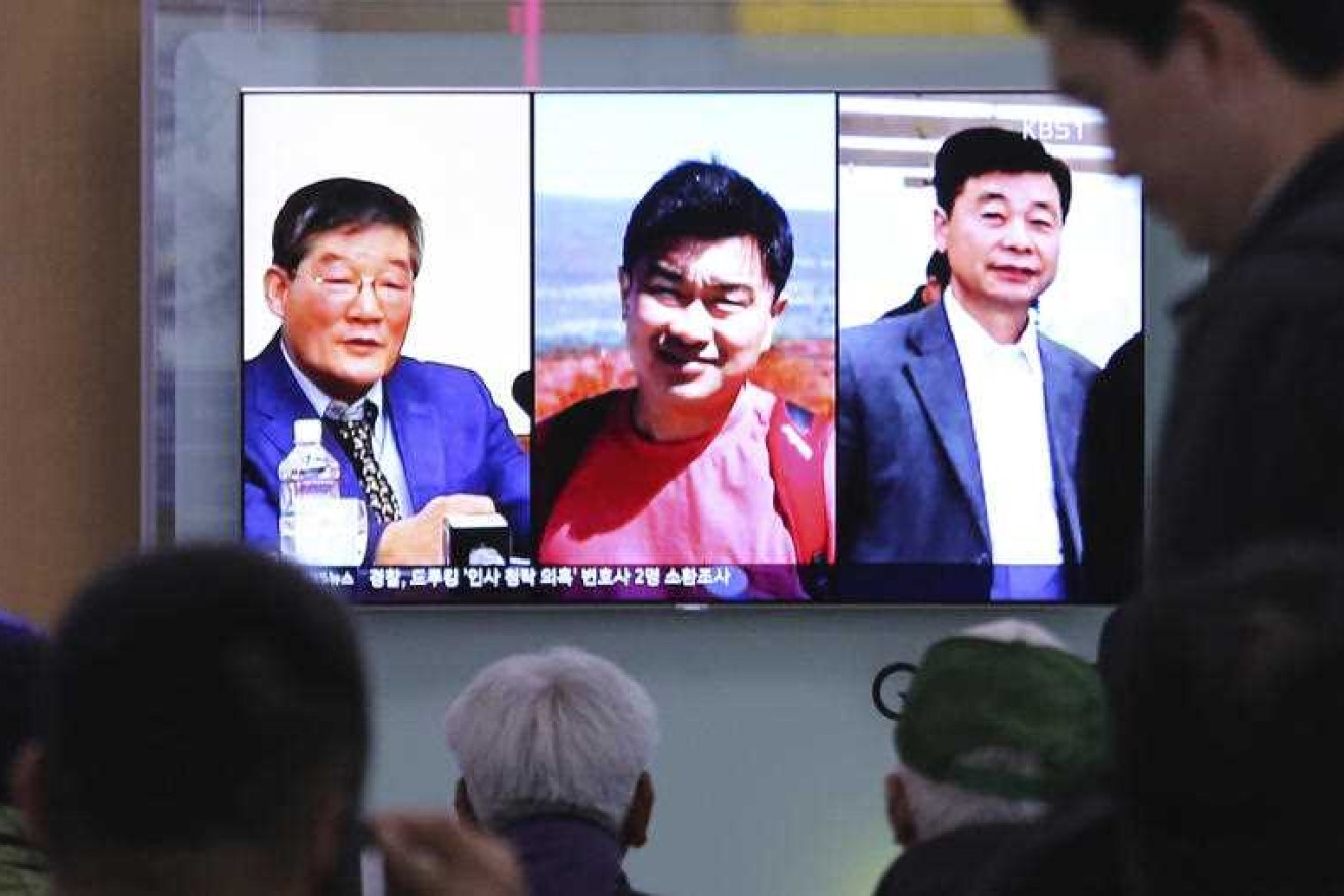 A TV report showing portraits of Americans, from left, Kim Dong Chul, Tony Kim and Kim Hak Song, detained in North Korea.