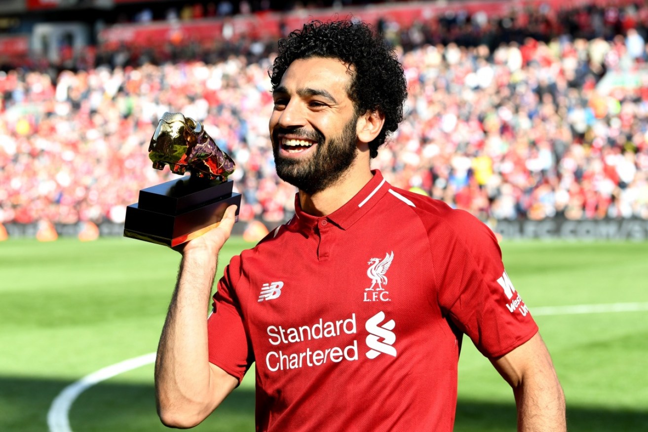 Mohamed Salah scored a record 32nd Premier League goal for the season as Liverpool beat Brighton.