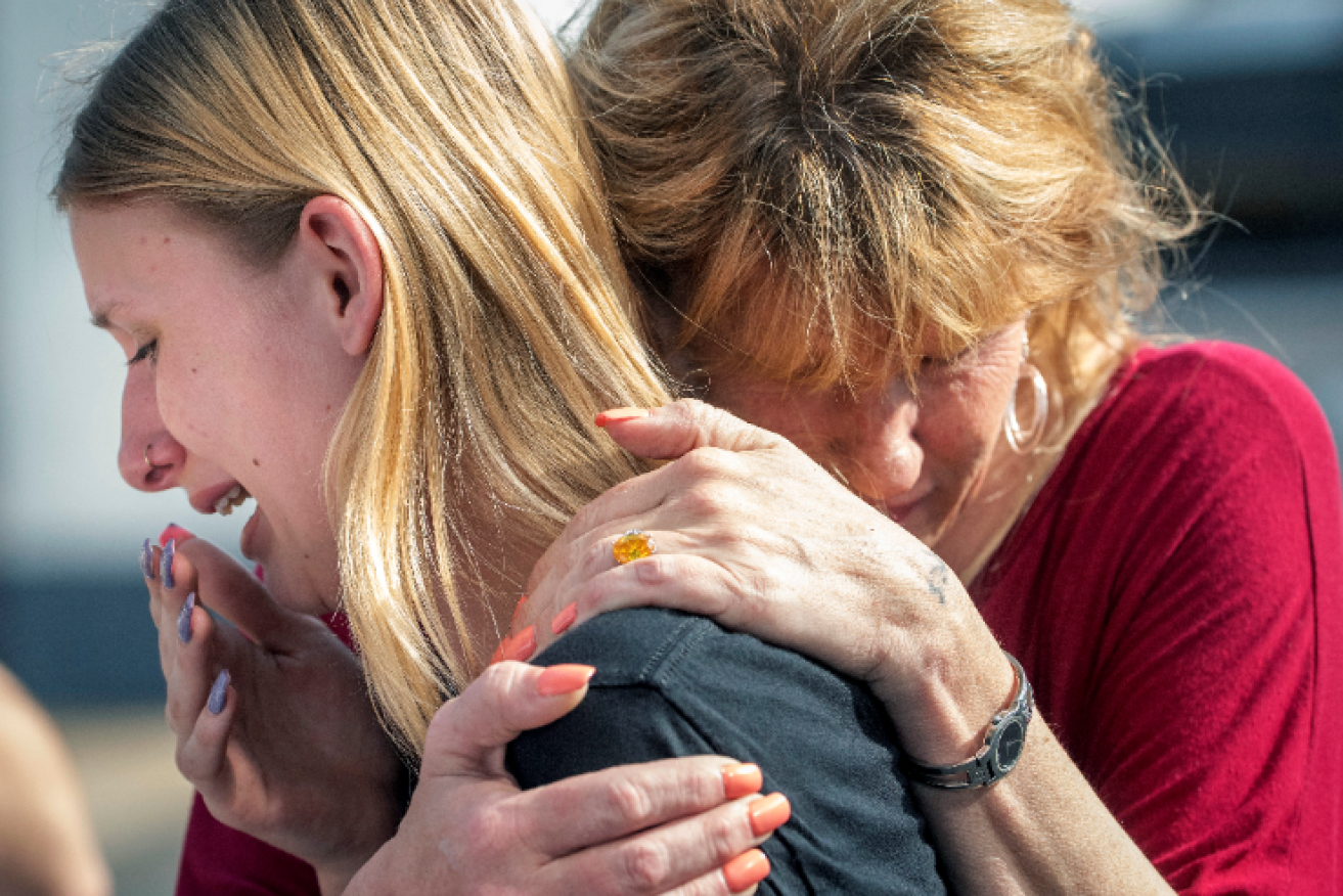 Santa Fe High School student Dakota Shrader  collapses in her mother's arms after learning her friend was shot.