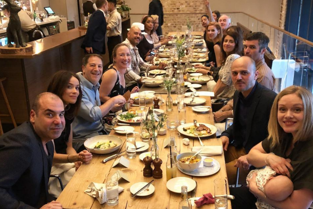 The Suits cast gather for a royal wedding eve dinner party to toast their former costar.