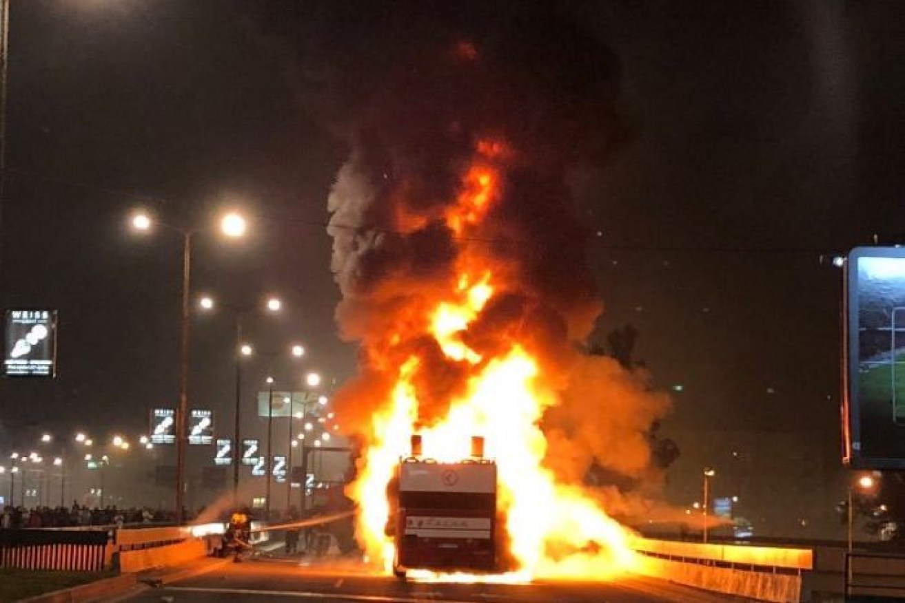 The Red Star Belgrade team bus on fire after the flare incident. 