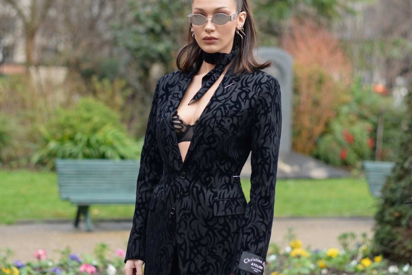 Bella Hadid is one of the bright young things inexplicably wearing tiny sunglasses to black tie events.