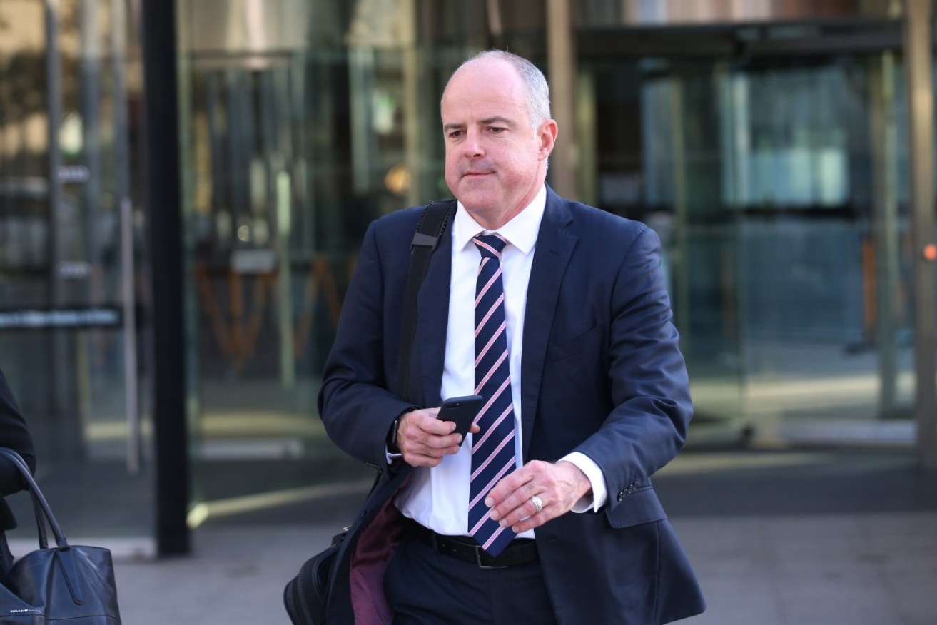 Suncorp executive David Carter leaves the Royal Commission in Melbourne.