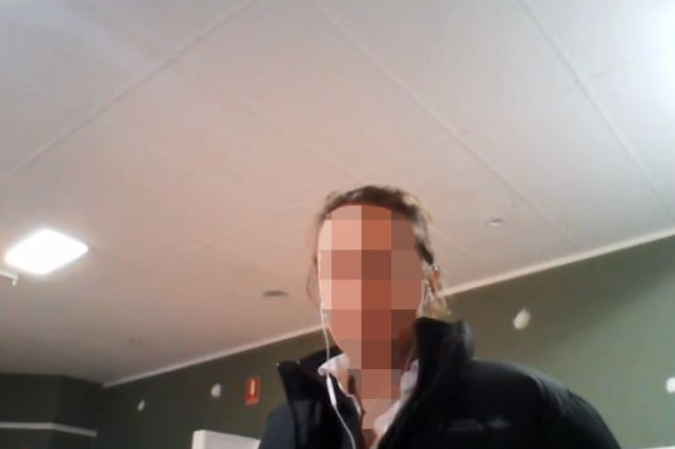 One of the scam's victims - his face  obscured -as he appeared on YouTube.
