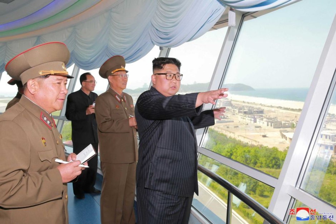 Kim Su-gil and North Korean leader Kim Jong-un talk military tactics.
