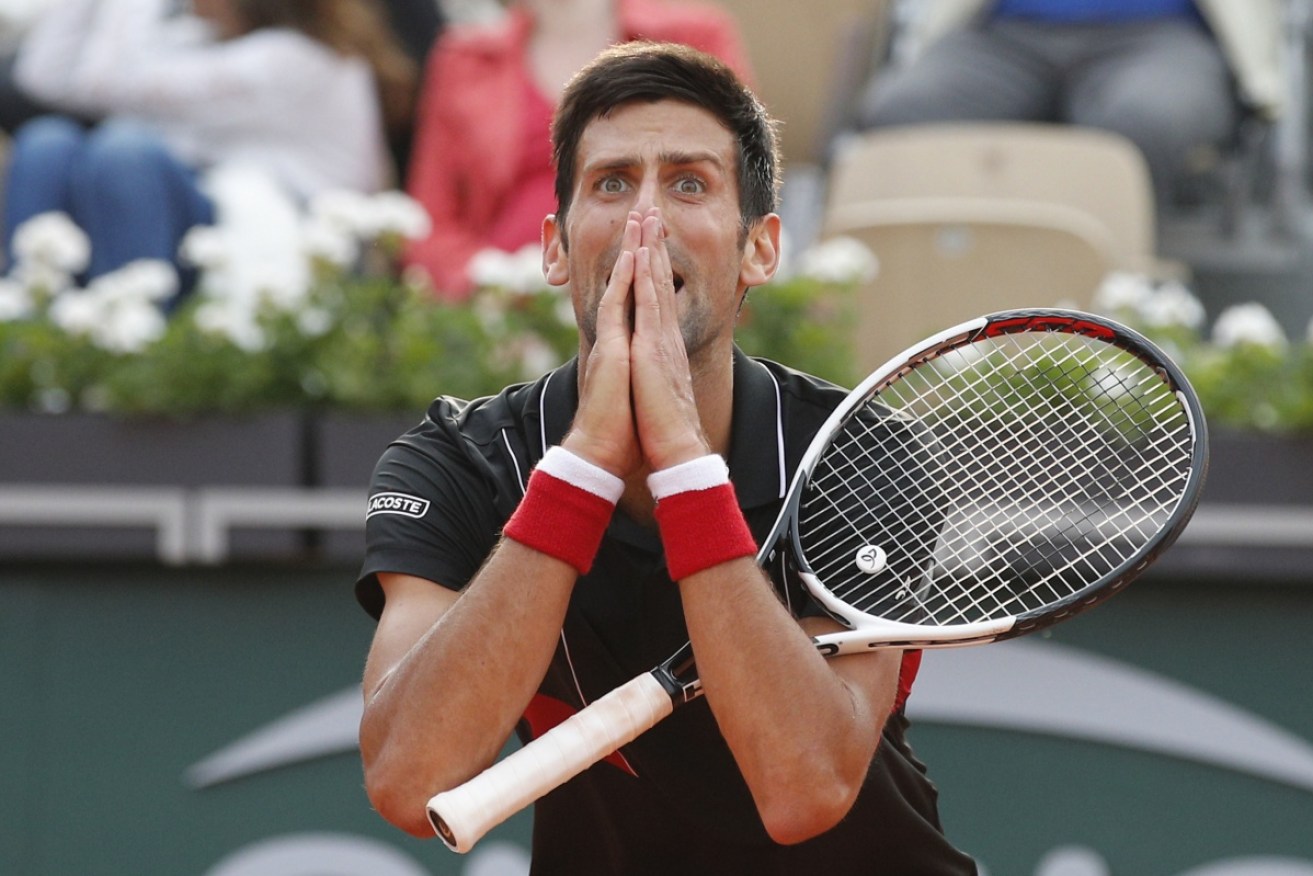 Novak Djokovic reacts after missing a shot against Marco Cecchinato in the fourth-set tie break.