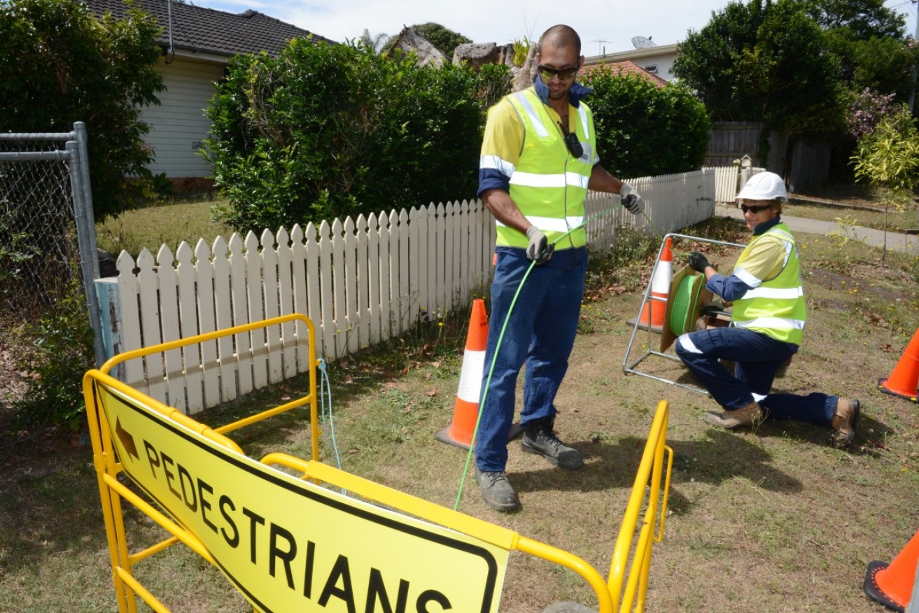 Workers connect the NBN to Brisbane homes.