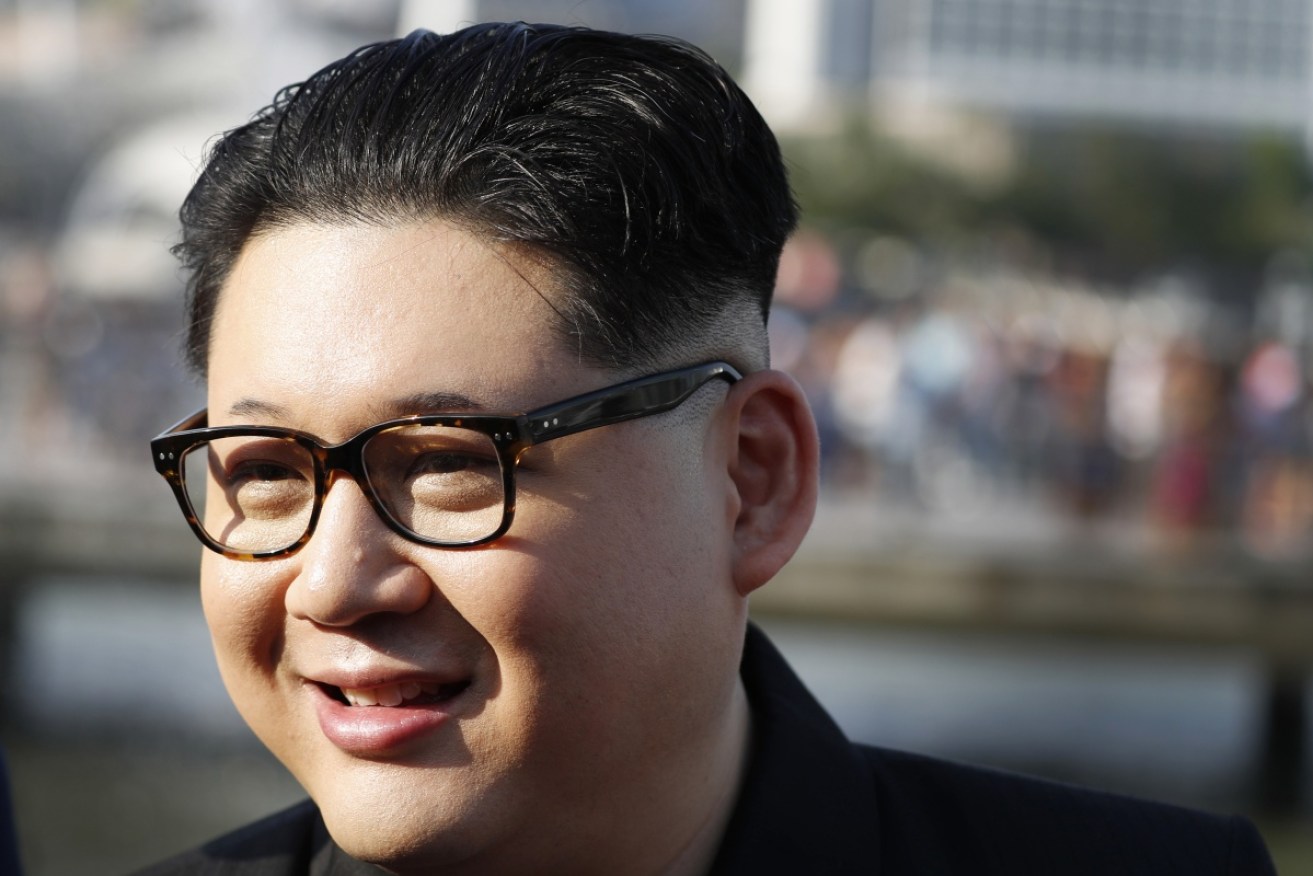 An Australian comedian known for impersonating North Korean leader Kim Jong Un says he was detained by Singaporean authorities.
