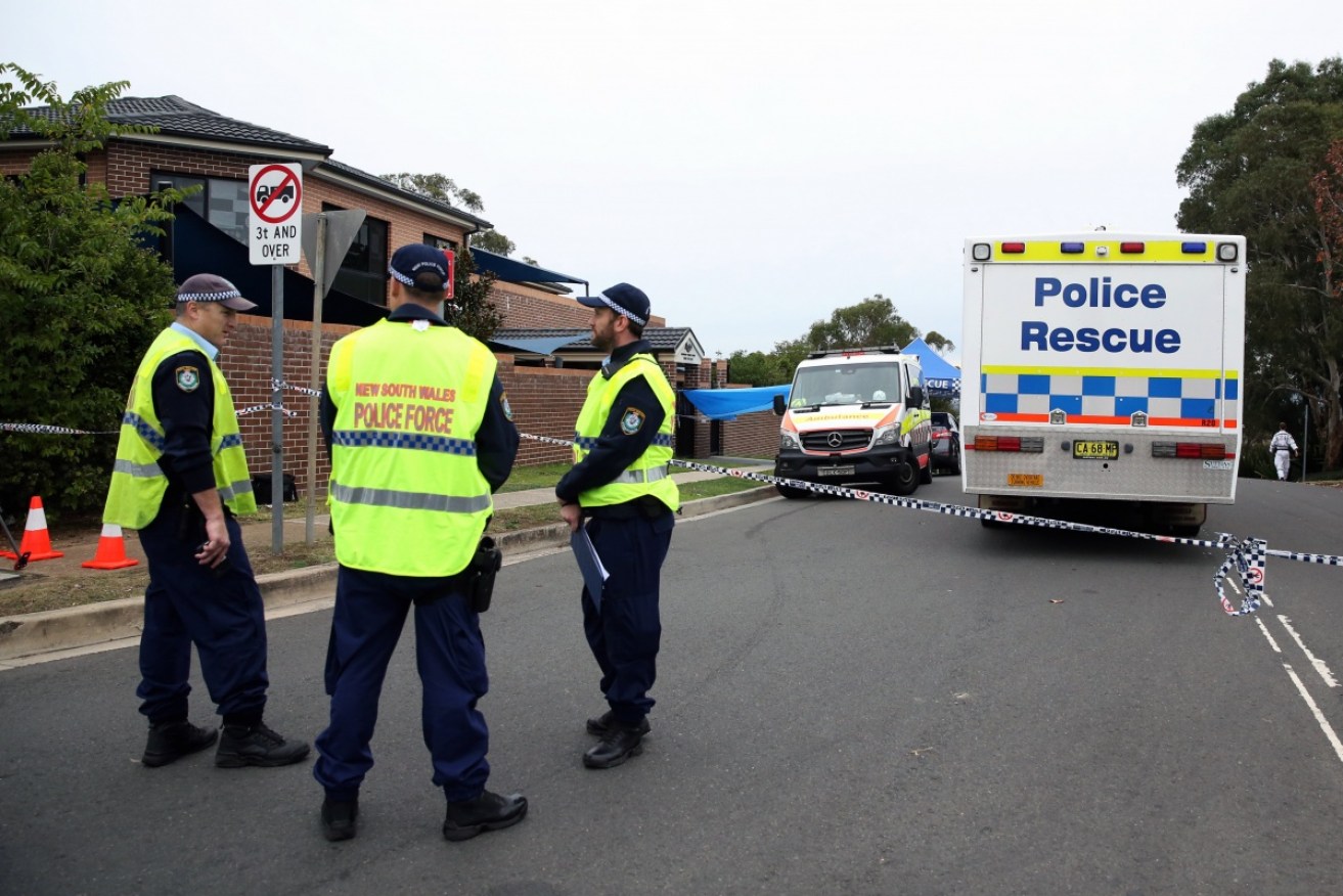 Forensic police gather evidence on the street in Carlingford, Sydney, where the child's life was snuffed out in a moment of mad horror.