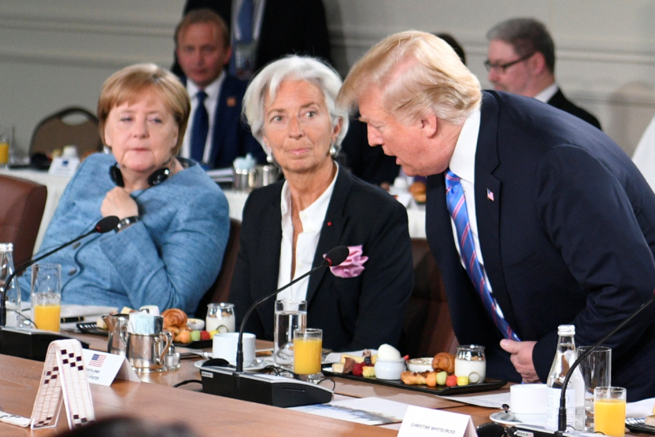 German Chancellor Angela Merkel (l) and IMF chief Christine Lagarde keep their cool as Trump accuses the rest of the world of exploiting America.