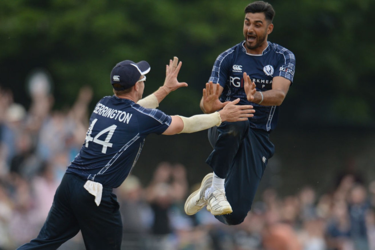 Safyaan Sharif celebrates after taking the final wicket of Mark Wood.