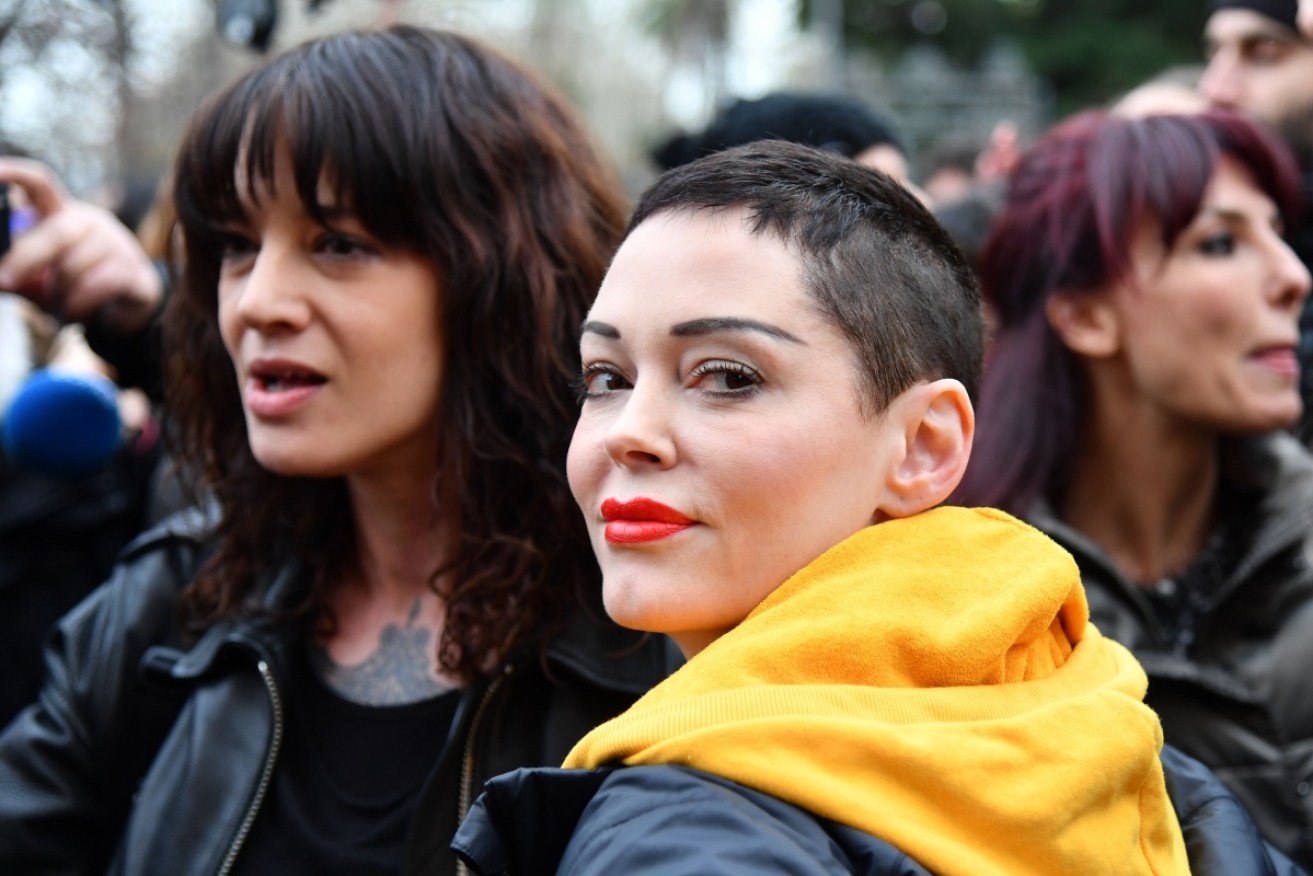 Asia Argento (L) and Rose McGowan march together during the #MeToo movement in March.