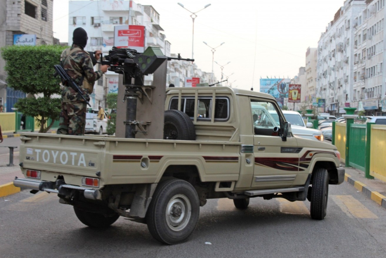 Yemeni loyalist fighters, backed by Saudi Arabia and the United Arab Emirates patrol the streets of central Aden on Monday. 