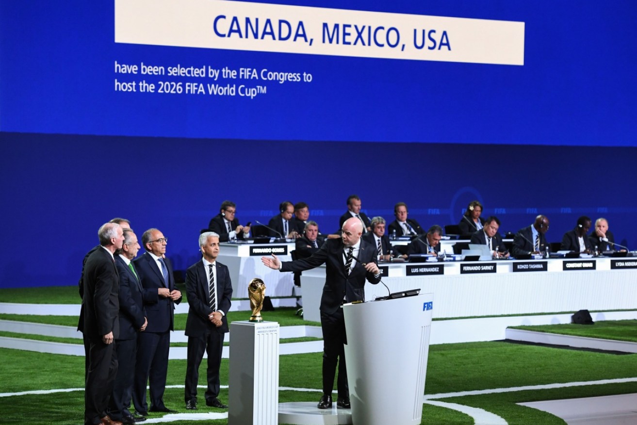 FIFA president Gianni Infantino congratulates the United 2026 bid officials Carlos Cordeiro, Decio de Maria Serrano and Steve Reed, at the FIFA Congress in Moscow.
