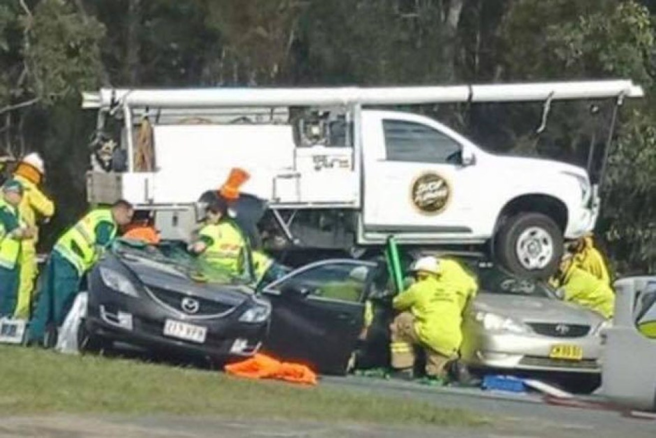 A ute landed on three cars north of Brisbane after coming off a highway off-ramp.