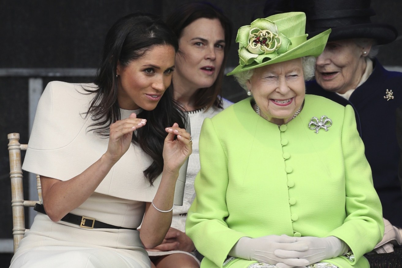 Meghan, the Duchess of Sussex, and Queen Elizabeth II share an insight at the opening of the new Mersey Gateway Bridge in north west England.