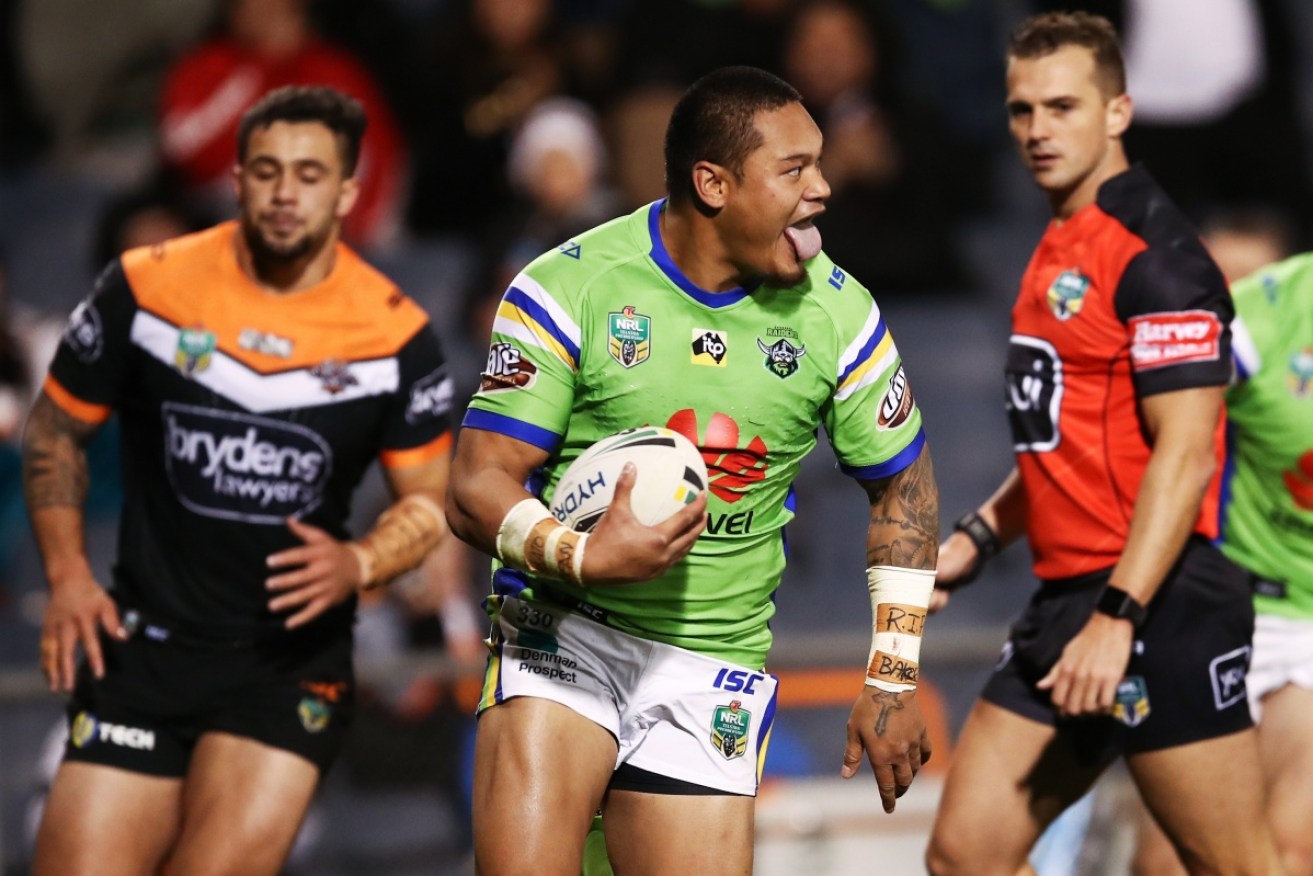 Canberra's Joseph Leilua enjoys one of his tries against Wests at Campbelltown Stadium on Sunday. 