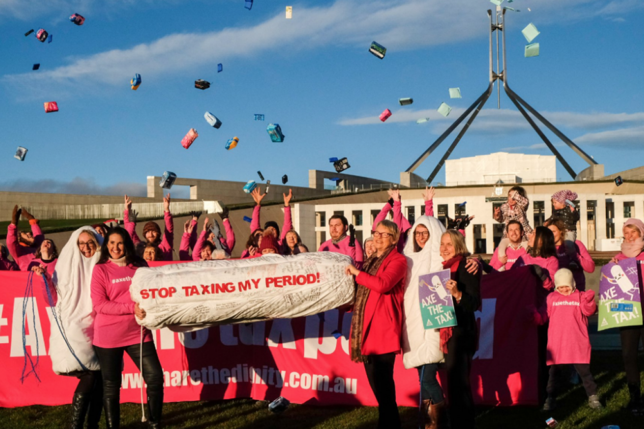 Senator Rice (in red jacket) at a Canberra protest against GST on sanitary products in June.