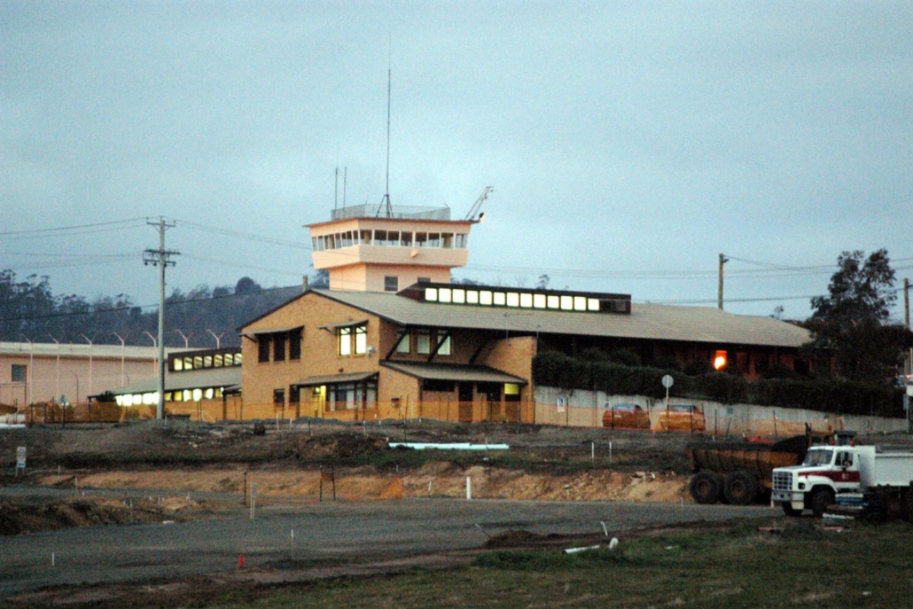 Hobart's Risdon Prison is in lockdown following a riot that injured four guards.