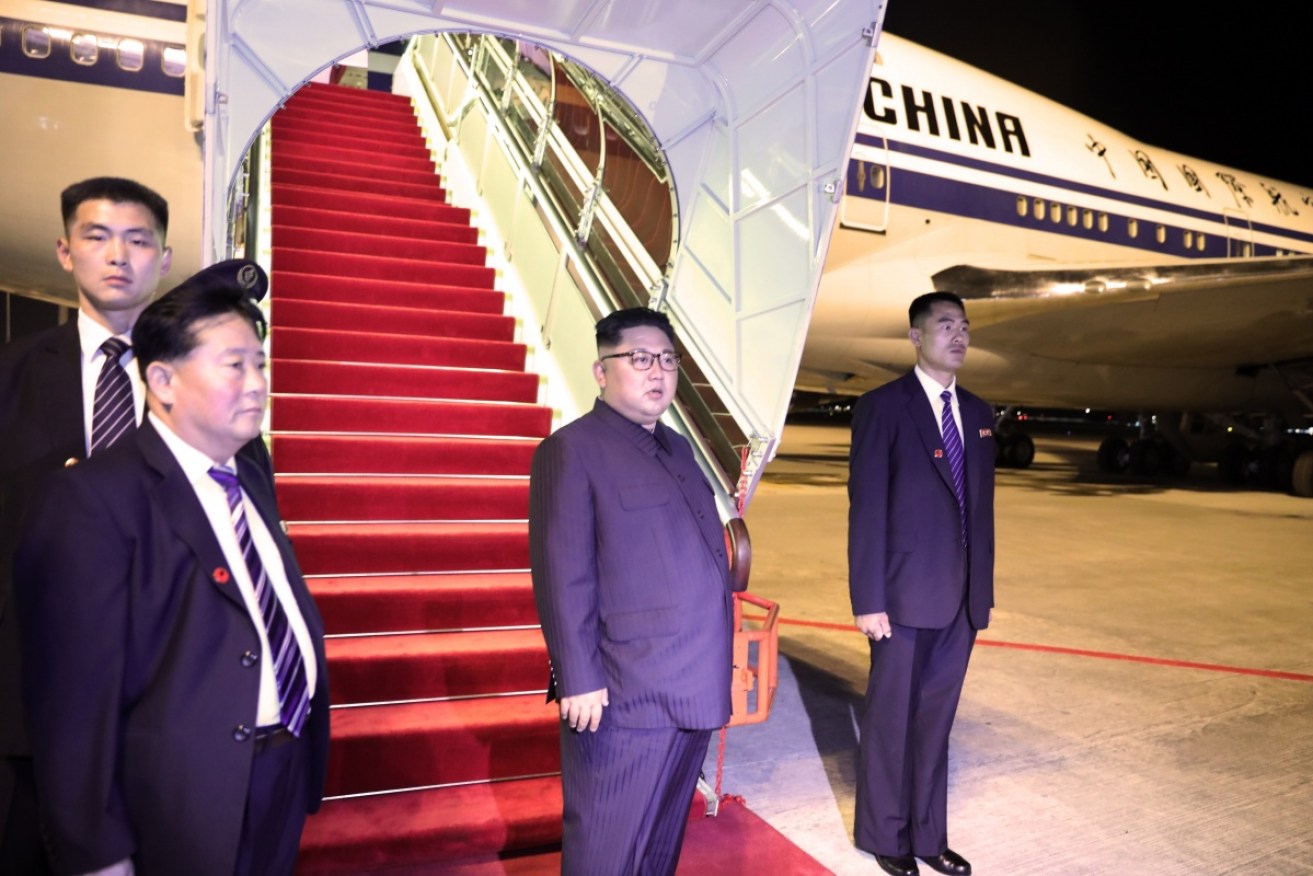 Kim Jong-un, seen here departing Singapore, has spent the past two days in Beijing.