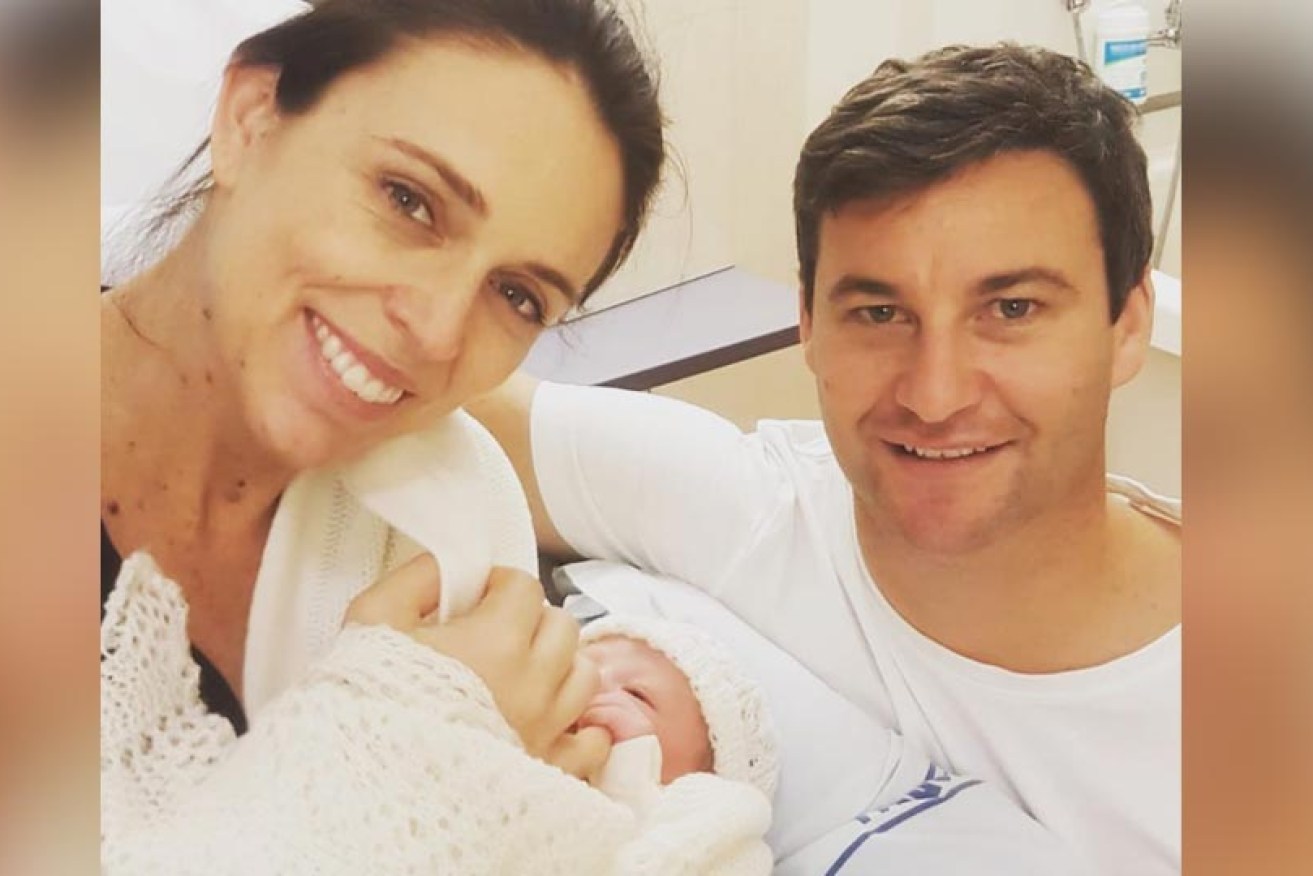 Jacinda Ardern poses with partner Clarke Gayford and their baby daughter.