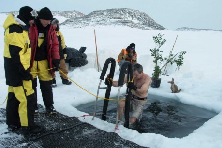 Antarctic expeditioners plunge into icy water at Casey Station to mark winter solstice
