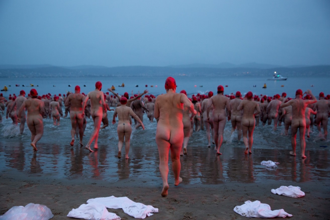 Participants mark the winter solstice with a shivery plunge during Dark Mofo's annual Nude Solstice Swim.