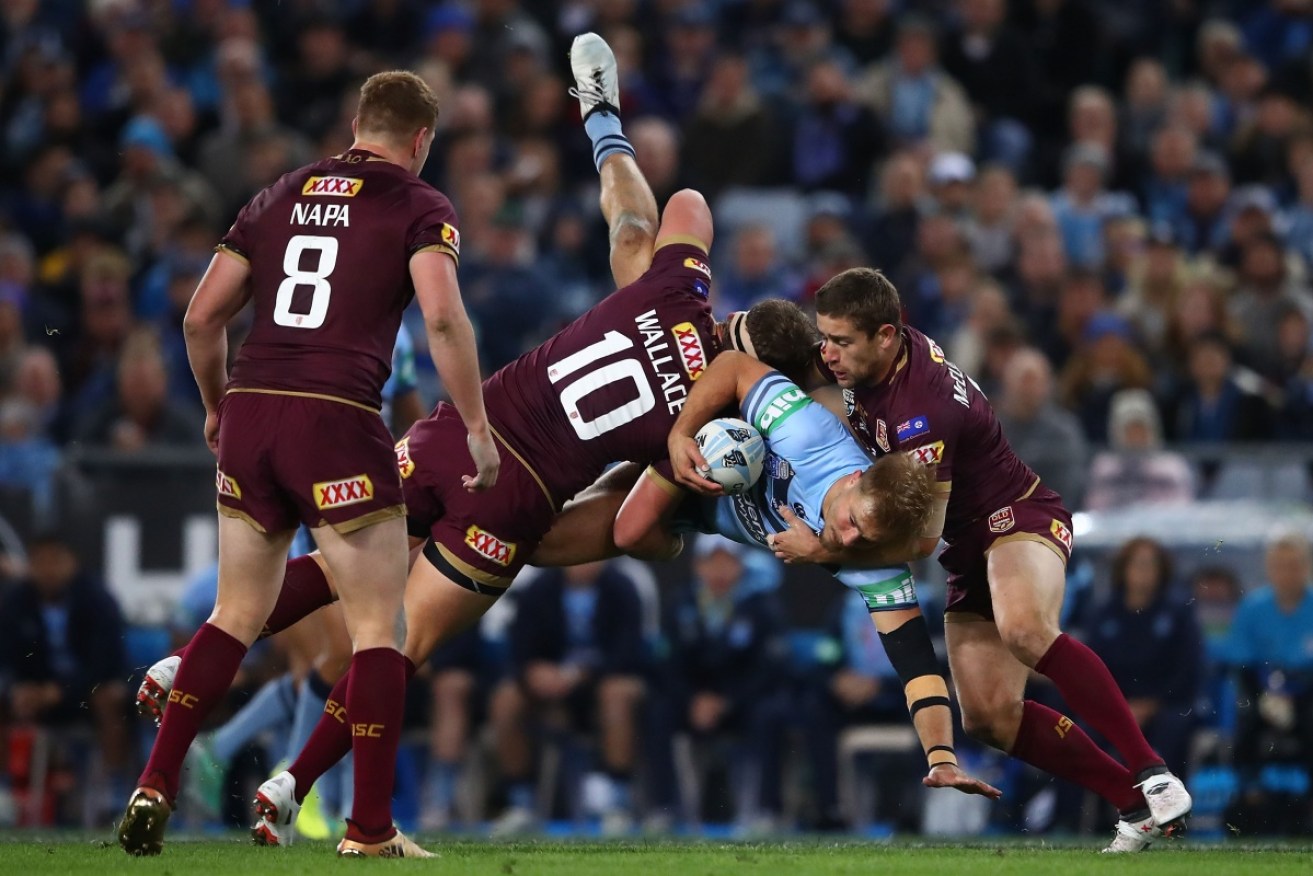 New South Wales' Jack De Belin is driven into the ground in 2018's game two of the State of Origin series against Queensland at ANZ Stadium. NSW won the series 2-1.