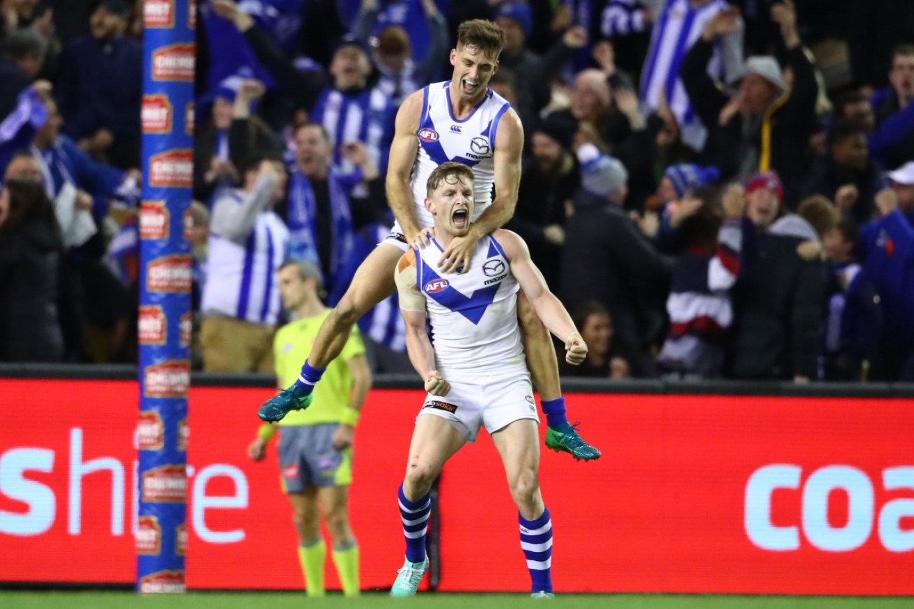 Jack Ziebell celebrates his dramatic winning goal for North Melbourne.