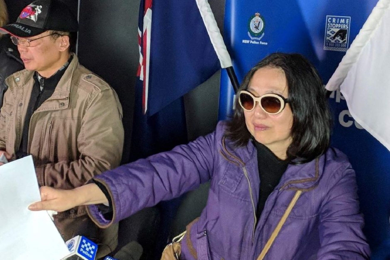 Qi Yu's family flew from China to Sydney and handed out flyers on Tuesday.