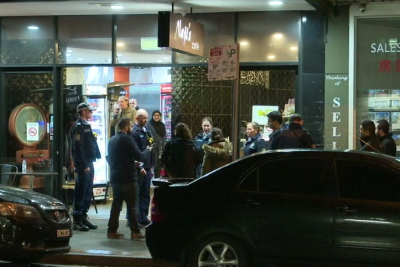A 27-year-old man has been charged with two counts of assault after a brawl outside a cafe in Arncliffe.