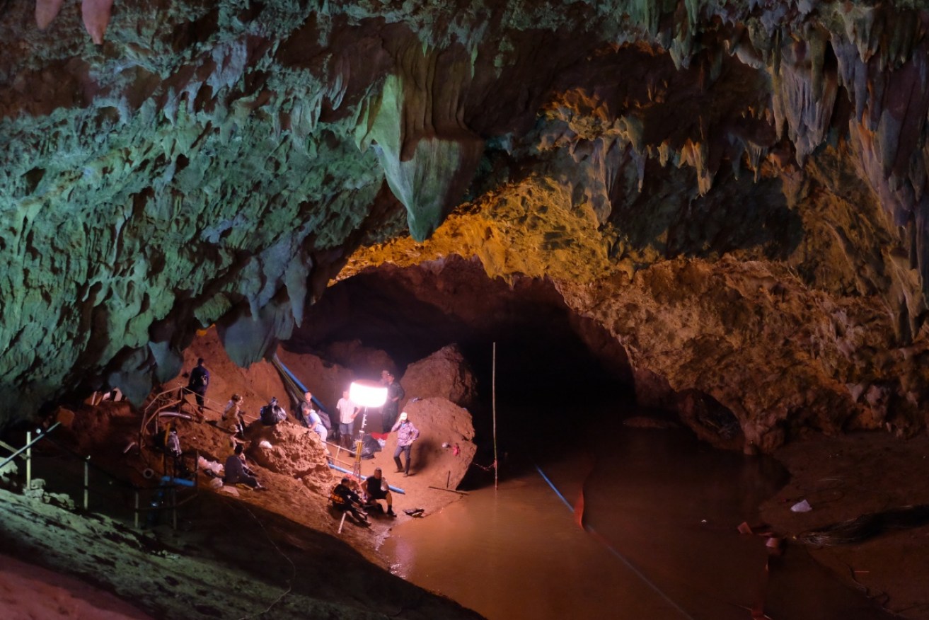Rescuers trying to reach a dozen boys and their football coach trapped inside a flooded cave.