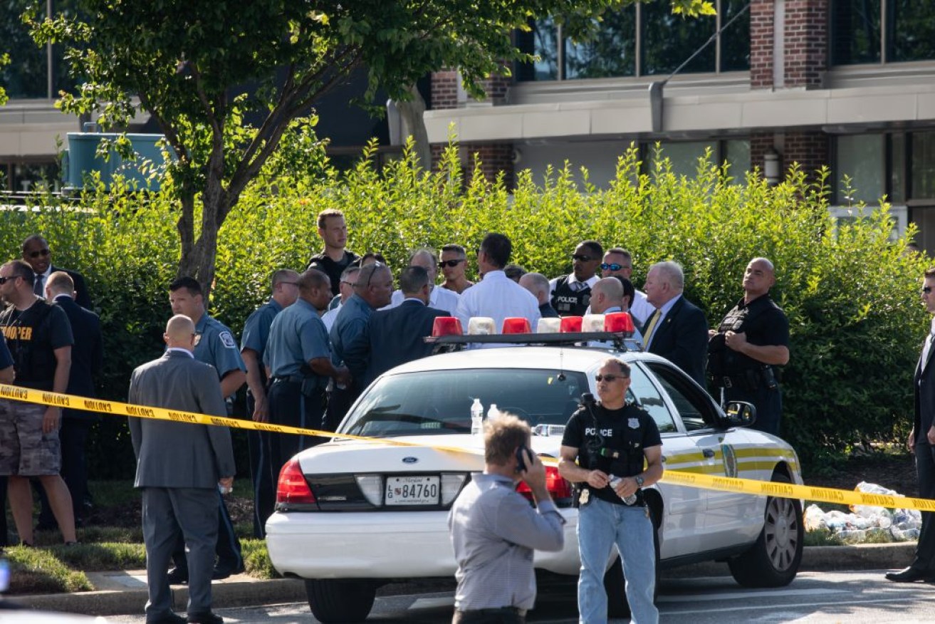 Staff trapped inside the Capital Gazette office on Bestgate Road described the scene as a 'war zone'.