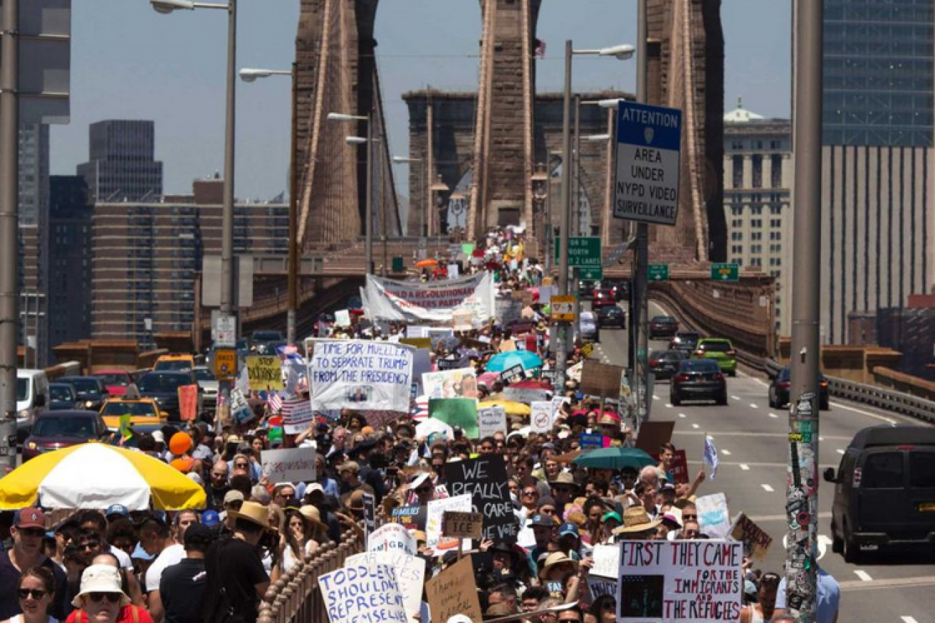 New York's iconic bridge fills with protesters -- and contempt for President Trump.