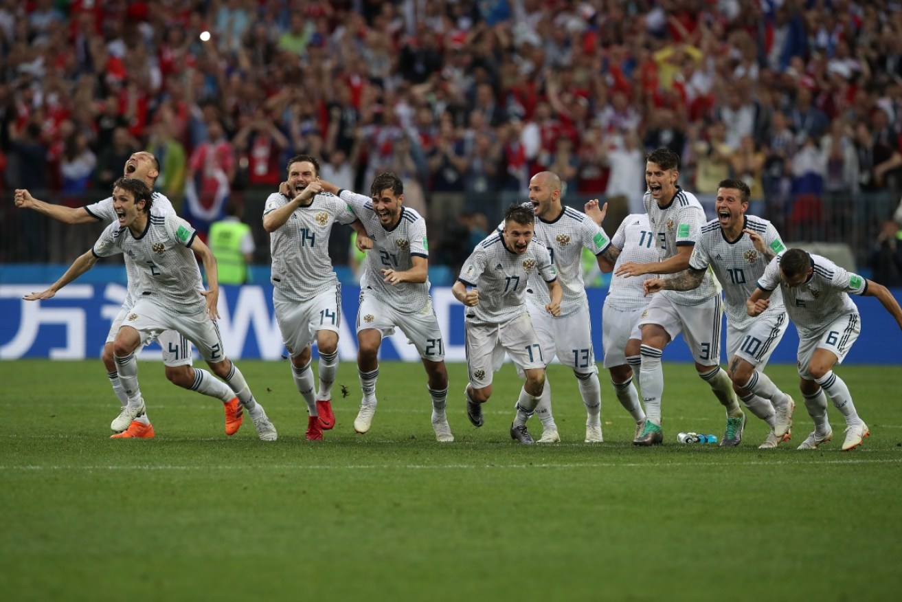The Russia team celebrate as they win the penalty shoot out against 2010 champions Spain.