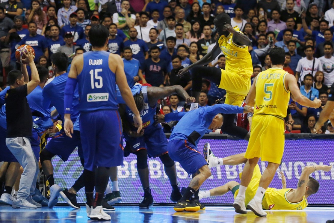 The Philippines and Australian players trade blows during the wild melee in Bulacan.