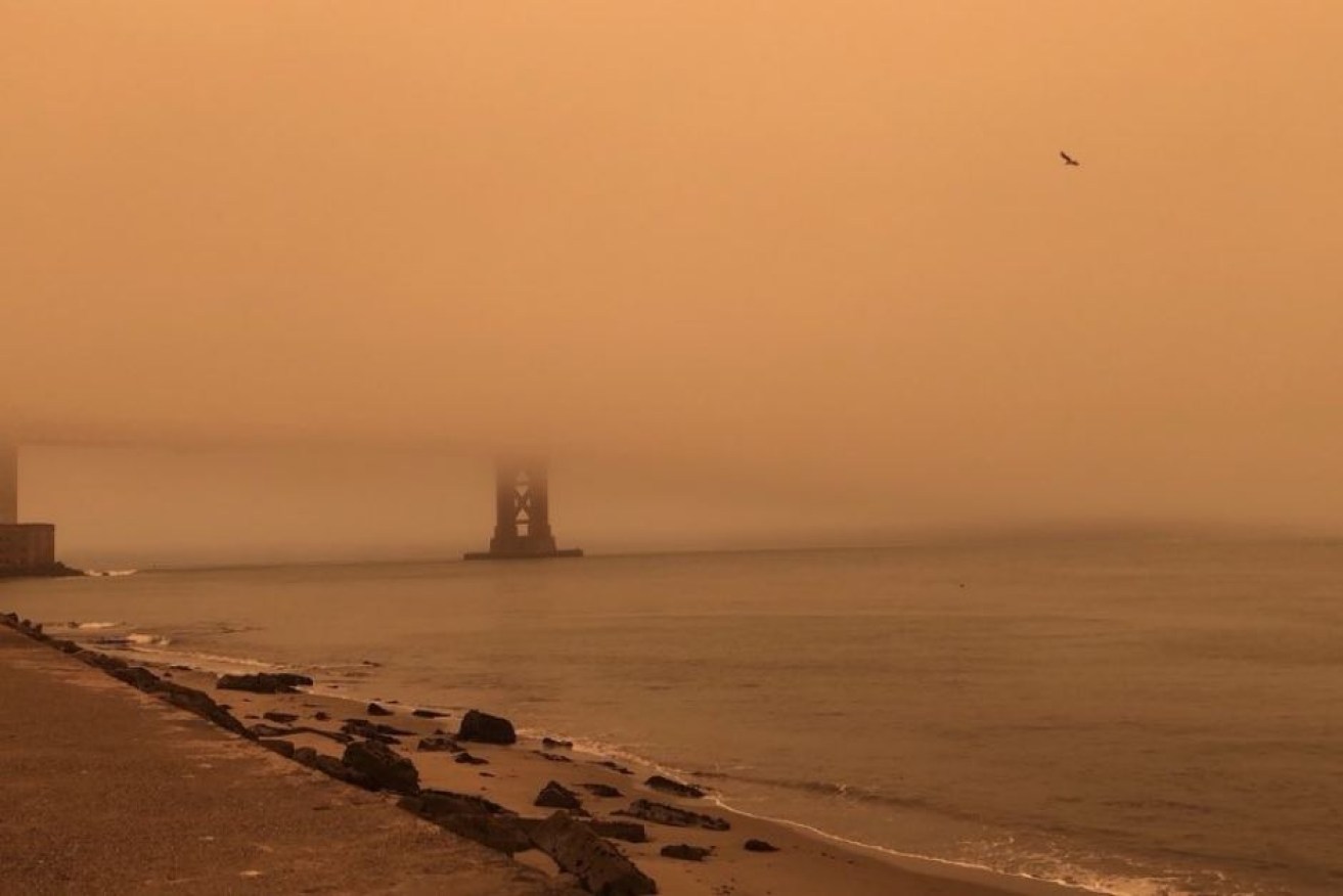 The Golden Gate Bridge disappears behind smoke caused by out-of-control fires in California.

