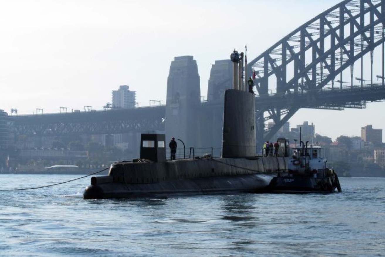 HMAS <i>Onslow</i>, part of the Australian submarine squadron in the 1960s, is towed in 2012.