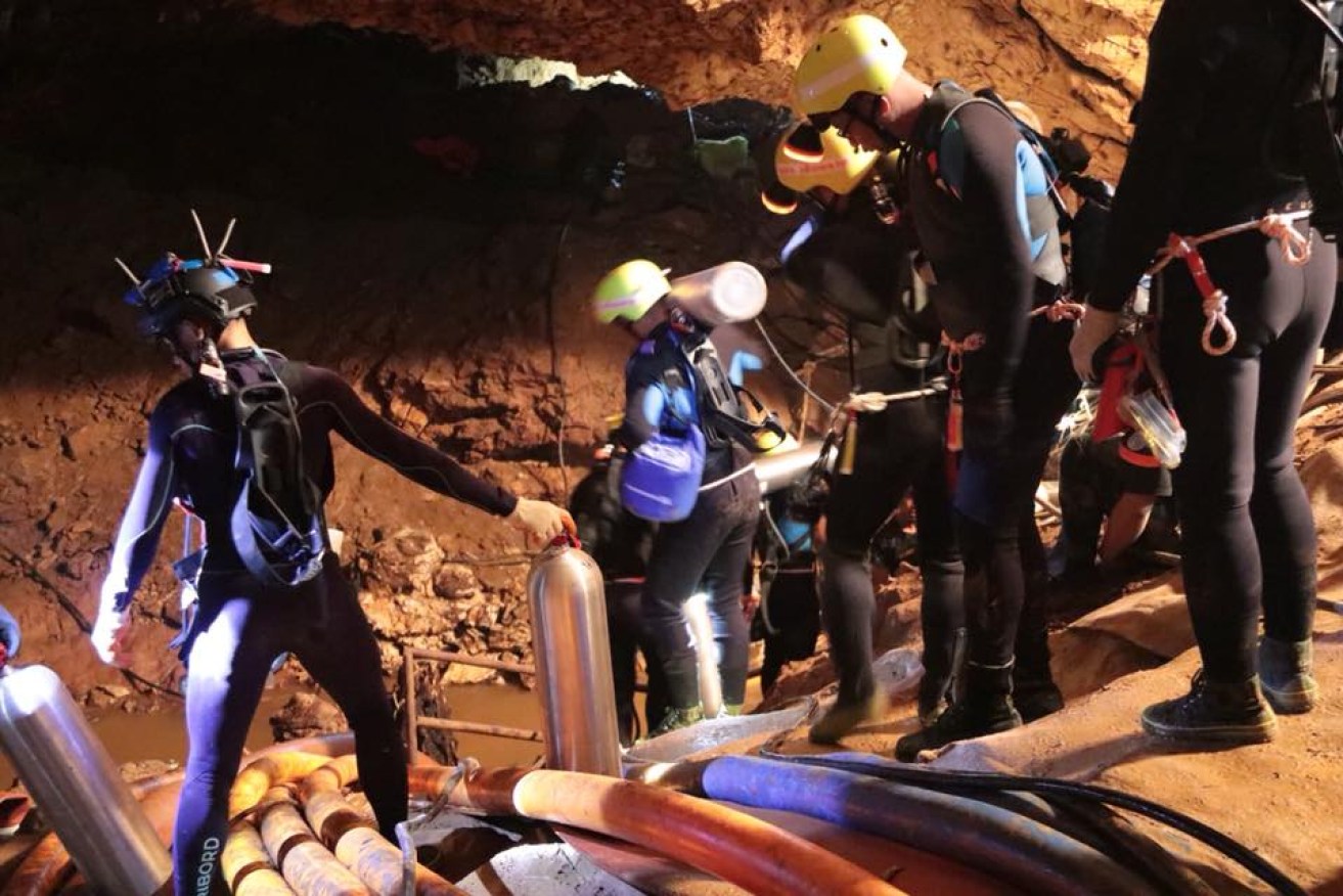 Royal Thai Navy divers prepare to re-enter the cave. 